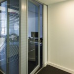 Glazed acoustic doors integrated with office partition